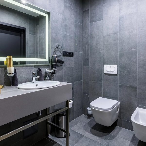 bathroom-interior-with-beautiful-ceramic-tiles-shower-grey-dark-color